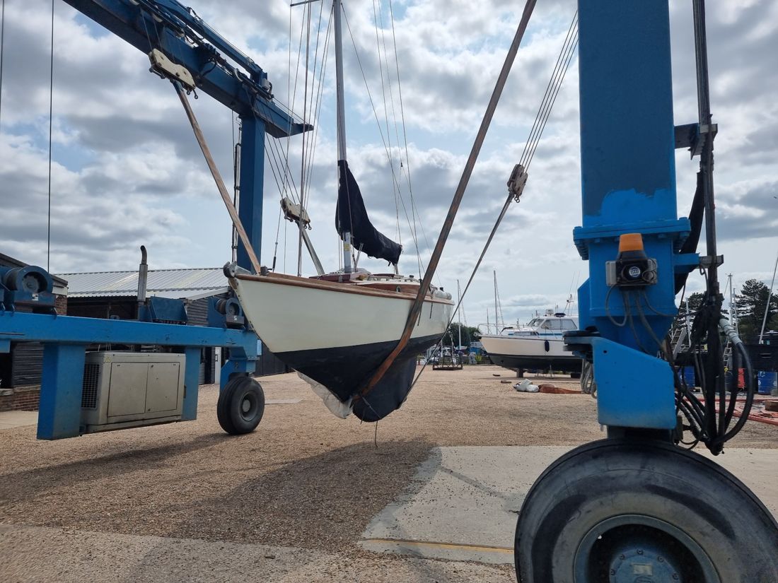 Folkdance in the slings of the boat hoist, going back in the water