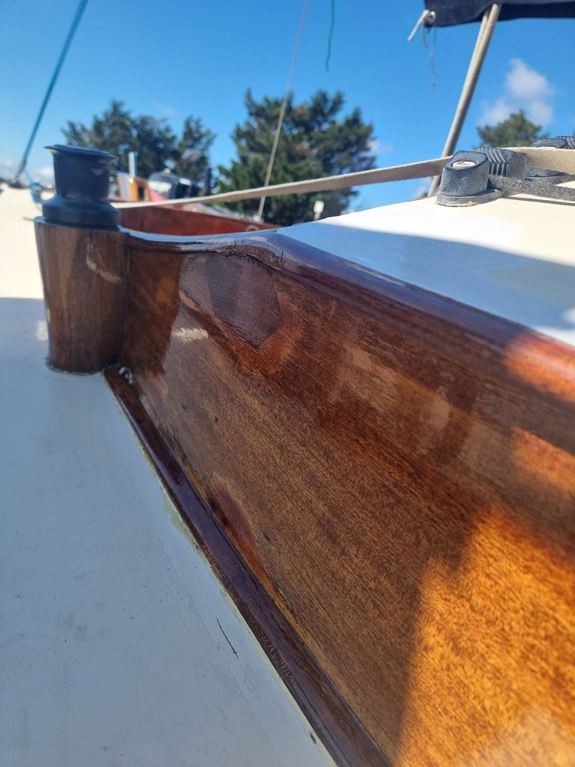 The repaired coaming corner, with a new timber insert scarfed in and varnished to match
