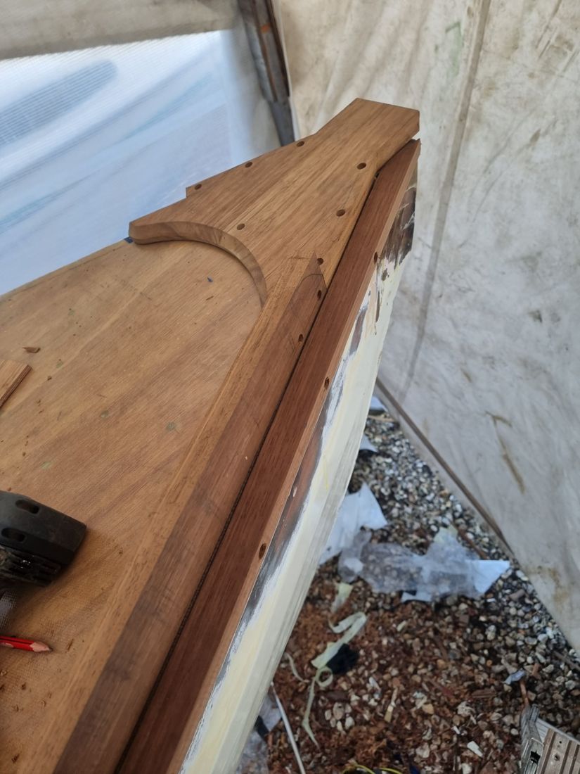 New oak king plank and covering boards being fitted at the bow, drilled for fastenings