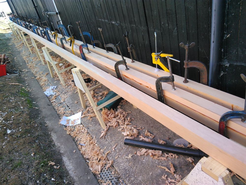 Mast blank glued and held by a long row of G-clamps