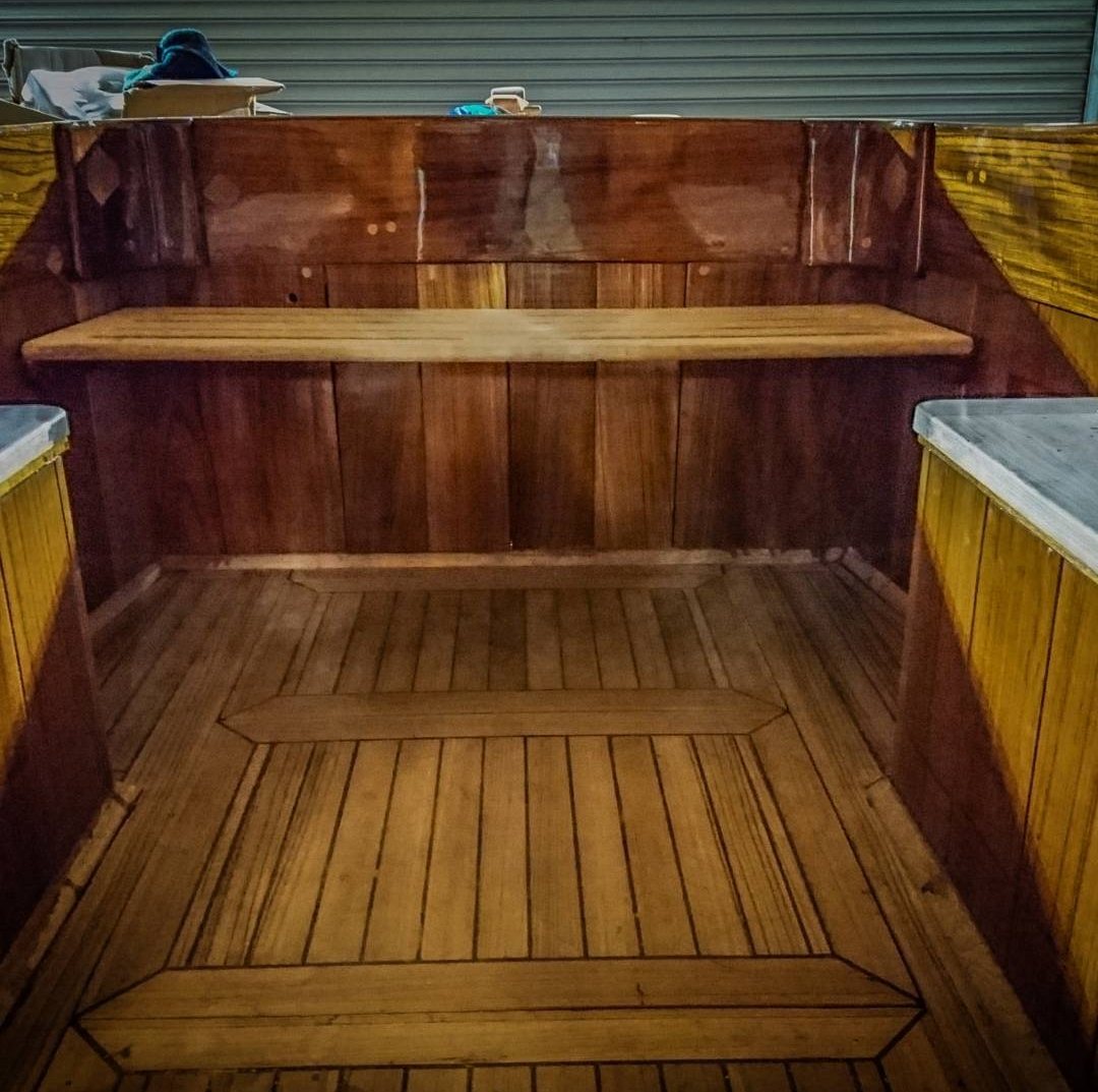 Roamer's new cockpit with a laid sole, framed panels and a varnished bridge deck